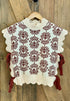 White sweater with brown floral pattern and bows on the side