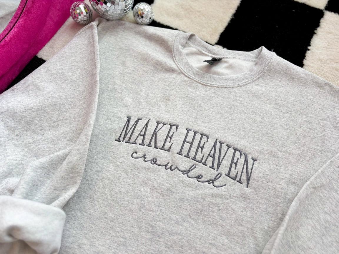 Gray sweatshirt with 'MAKE HEAVEN crowded'