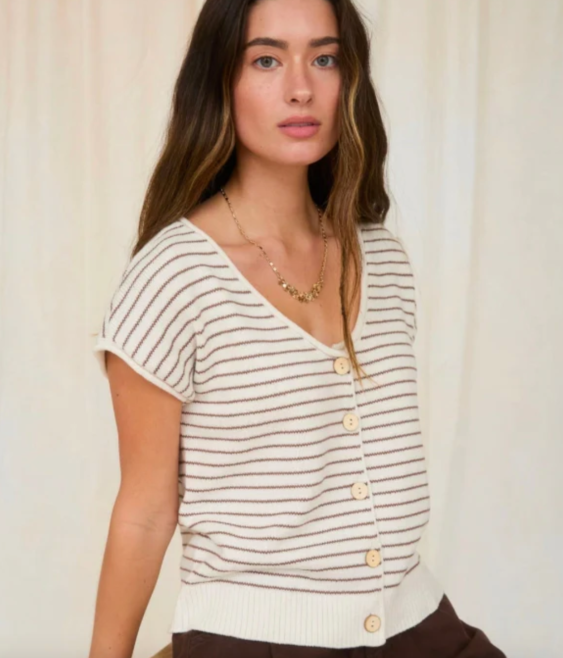 Elevate your layering game with this versatile scoop neck cardigan, designed for effortless sophistication. The raw edge detailing adds contemporary edge while the short sleeves offer breathable comfort for transitional seasons. 