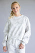 white marble-textured sweatshirt
