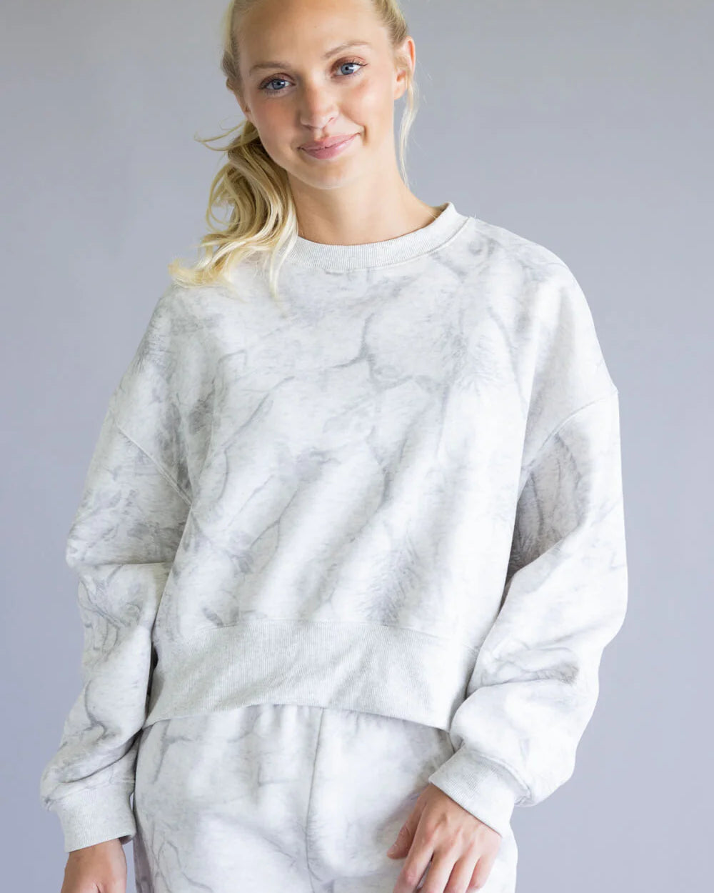 white marble-textured sweatshirt