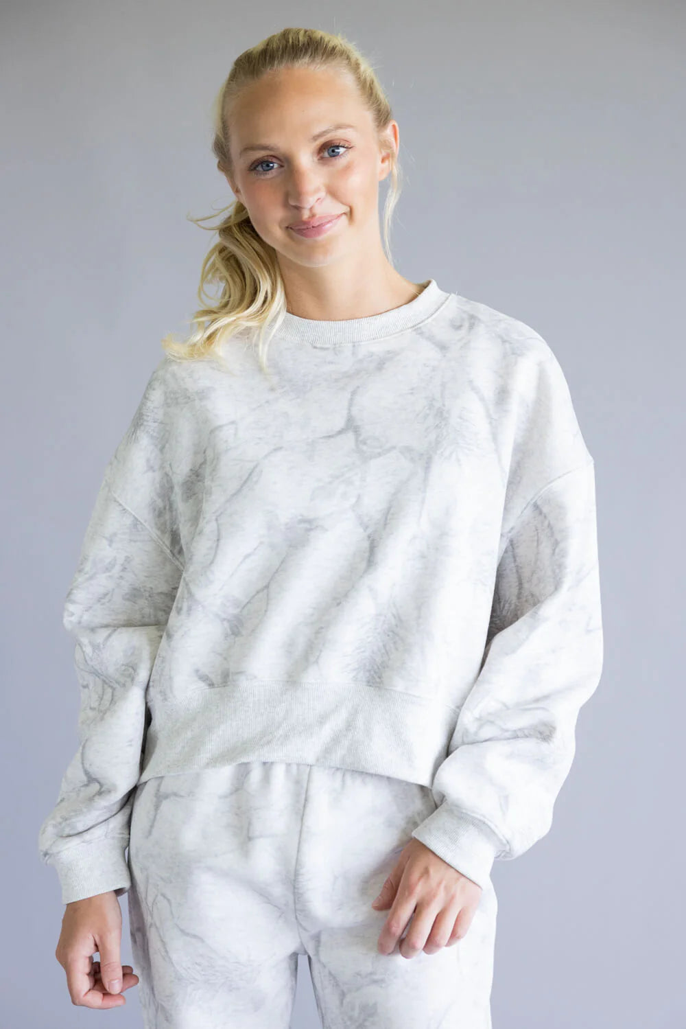white marble-textured sweatshirt